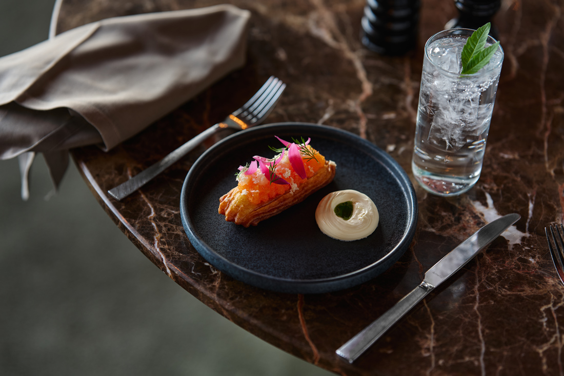 Image of the signature dish Éclair, featured on the anniversary menu at Heaven 23.